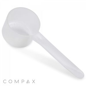A 50cc translucent plastic scoop with a long handle, specifically designed for measuring powdered substances, is shown against a plain white background. The word "COMPAX" appears at the bottom left corner of the image.