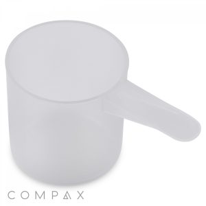 The 68.5cc Scoop is a transparent, plastic measuring scoop featuring a small side handle. This cylindrical and lightweight scoop prominently displays the "COMPAX" logo at its base.