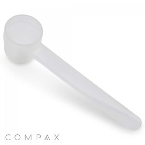 A white plastic 1.5cc Scoop with a long handle, ideal for measuring powdered substances. The background is white, and the word "COMPAX" is printed in gray at the bottom left corner.