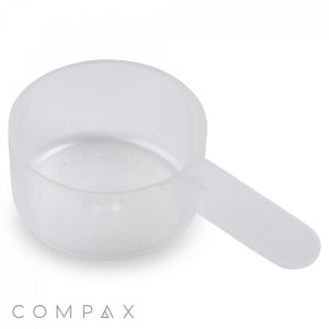 A translucent plastic 26.5cc Scoop with a wide, shallow bowl and a short handle is shown against a white background. The brand name "COMPAX" is visible at the bottom of the image.