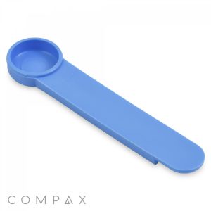 Introducing the .625cc Scoop: a blue plastic measuring spoon with a flat handle. The spoon features a circular scoop on one end and has a handle designed with a clip that can be used to seal and secure bags. The brand name "COMPAX" is displayed in gray text at the bottom left corner.