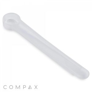 A 1cc Scoop in translucent plastic with a rounded end and elongated handle, displayed against a plain white background. The brand name "COMPAX" is inscribed in light gray at the bottom left corner.