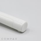 Close-up of a white cylindrical object, possibly the 16mm Flip Top, with the word "COMPAX" partially visible in the bottom left corner. The focus is on the cap end, and the background is light grey.