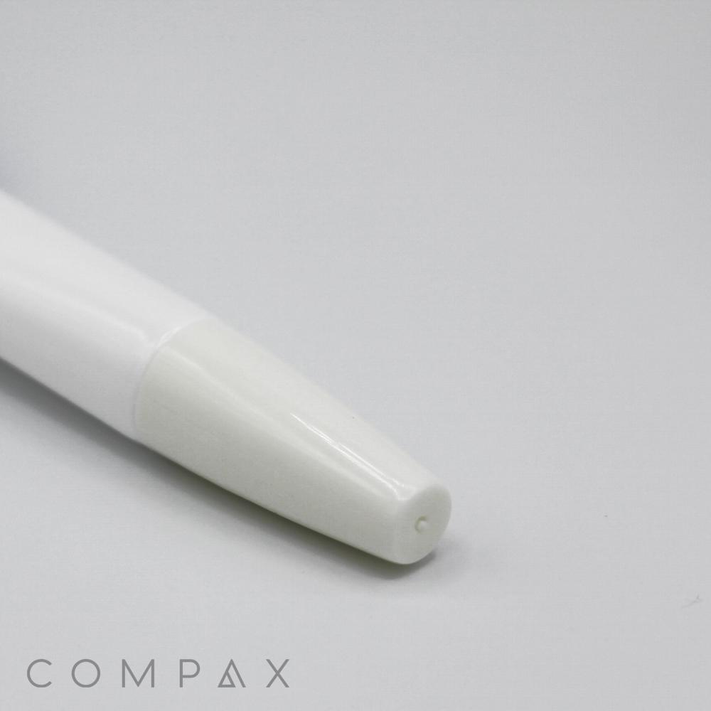 Close-up of the tip of a 16mm brush applicator against a light grey background. The applicator features a smooth, minimalistic design with the brand name "COMPAX" visible in the corner.