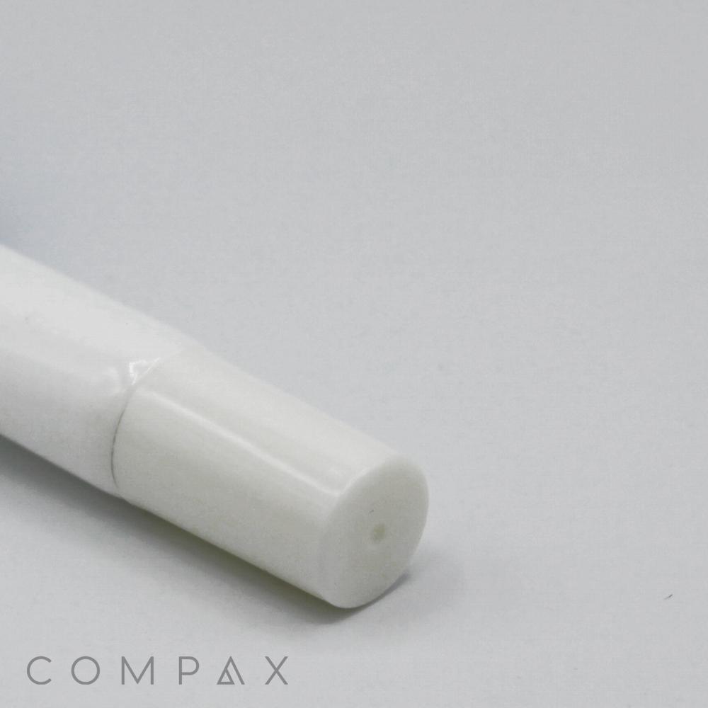 A close-up of a white cylindrical object with a rounded cap, possibly a tube of cream or ointment, placed on a light gray background. The word "16mm Needle Nose" is partially visible at the bottom left corner of the image.