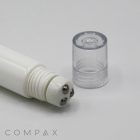 A white cylindrical 19mm Roller skincare tool features three metallic roller balls at one end and a clear plastic cap beside it. The word "COMPAX" is displayed in gray text at the bottom left corner of the image.