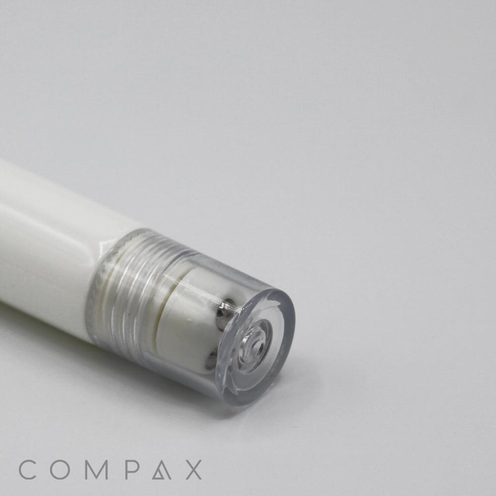 A close-up view of a 19mm Roller, a white cylindrical object with a transparent cap on one end, placed against a plain white background. The object has the brand name "COMPAX" displayed in light grey text.
