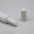 A 19mm Lip Applicator, characterized by its white, cylindrical plastic design with the cap removed, is displayed against a plain background. It features a narrow, pointed nozzle for precise dispensing of its contents.