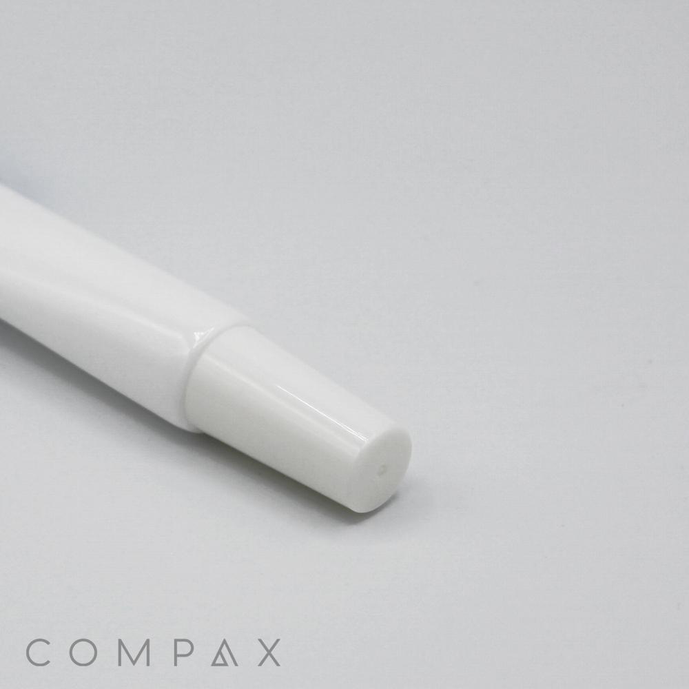 A close-up image of a smooth, white cylindrical object, identified as a "19mm Lip Applicator," with the brand name "COMPAX" visible in the lower left corner against a light grey background. The object features a clean, minimalist design and tapers toward its tip.