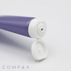 A close-up of a purple squeeze tube with a white, flip-top cap that is open, revealing the tube's dispensing nozzle. The tube is positioned horizontally against a white background, and the product name "25mm Flip Top" is displayed in the bottom left corner.
