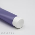 A close-up image of a purple cylindrical tube with a white cap, placed against a plain white background. The words "25mm Flip Top" are written in gray capital letters at the bottom left corner of the image.