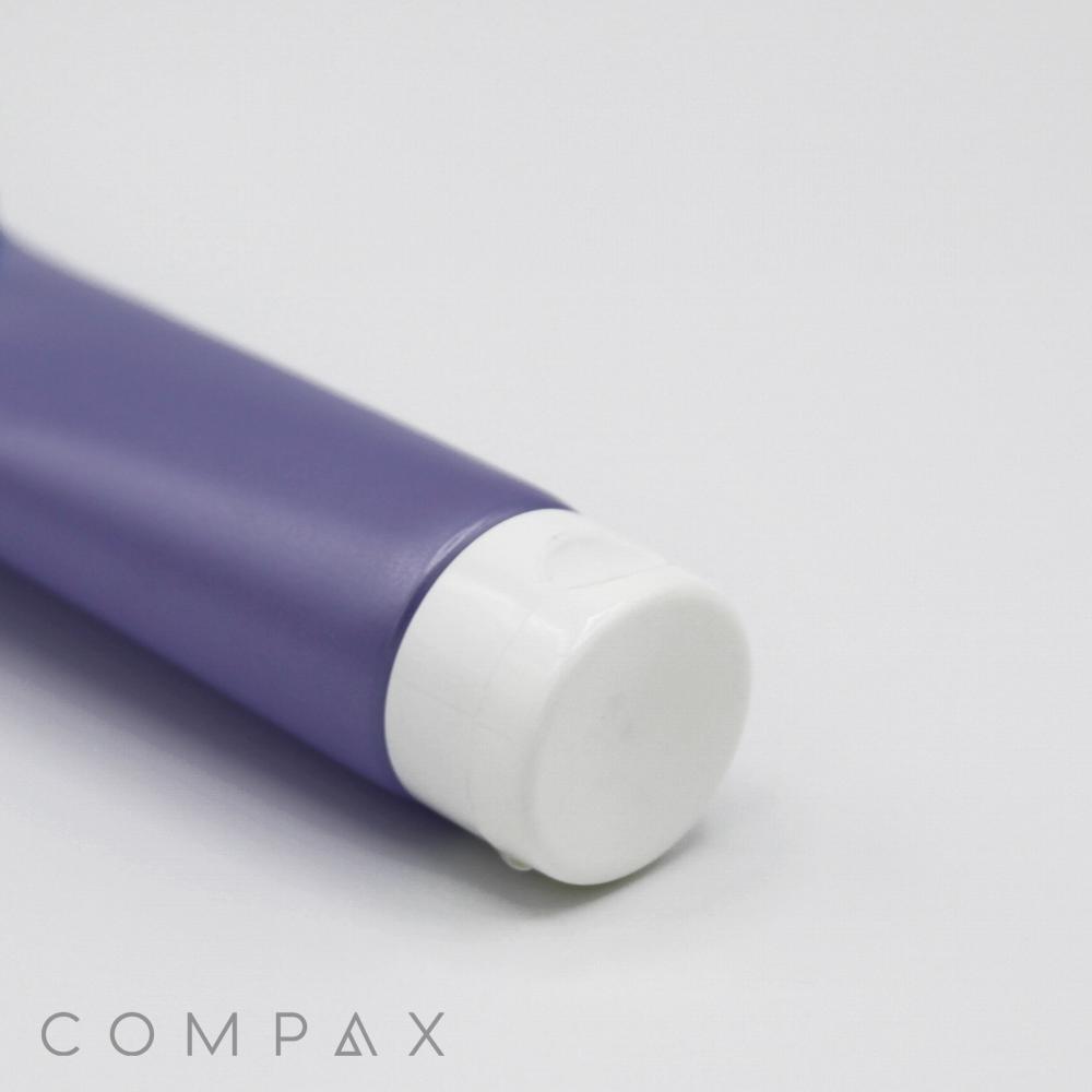 A close-up image of a purple cylindrical tube with a white cap, placed against a plain white background. The words "25mm Flip Top" are written in gray capital letters at the bottom left corner of the image.