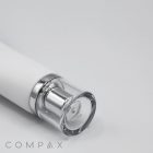 A close-up image of a sleek, cylindrical white and silver bottle labeled "25mm Screw Top" lies on a plain white surface. The transparent bottle cap reveals a small amount of the contents inside. The text "COMPAX" is visible in the bottom left corner.