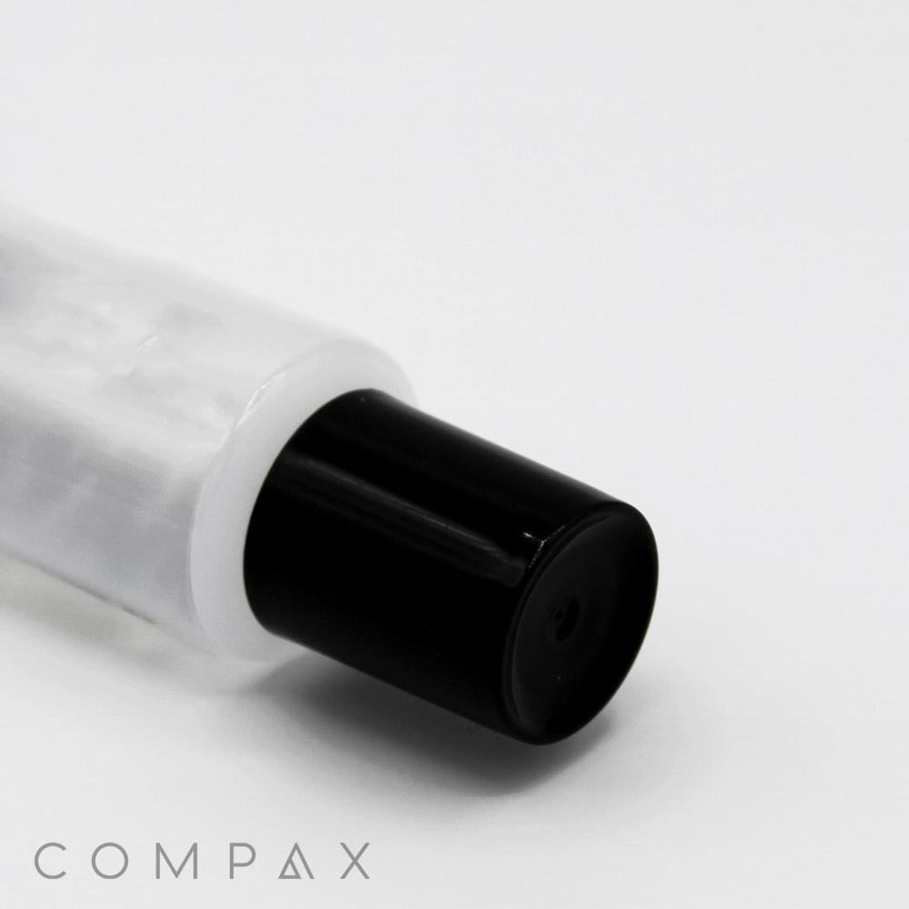 A close-up image of a white bottle with a black cap, likely a cosmetic or skincare product. The words "25mm Needle Nose" are faintly visible in the bottom left corner against the plain white background.
