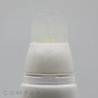 A close-up image of a white spray bottle with a transparent plastic cap, featuring an "ON" marking near the top. The background is plain light gray, and the word "COMPAX" is faintly visible in the bottom left corner. The product is identified as the 30mm Oval Silicone Brush Twist.