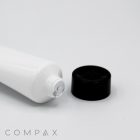 A 30mm Screw Top white squeeze tube with the cap off, revealing the sealed opening of the tube. The black cap is positioned next to the tube, showcasing an intact inner seal. The brand name "COMPAX" is visible in the bottom left corner of the image.