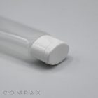 A close-up image of a transparent plastic bottle with a white cap lying on its side. The bottle appears to be empty. The words "30mm Oval Flip Top" are printed in the bottom left corner. The background is a plain, light gray surface.