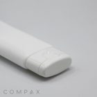 A close-up image of a "35mm Flat Flip Top" white plastic tube with a flip-top cap, positioned on a light grey background. The cap is closed, and the tube features a clean and simple design. The brand name "COMPAX" is partially visible in the lower left corner.