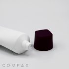 A white tube with a screw top end lies on a flat surface next to a detached, dark purple cap. The image is labeled with the text "35mm Screw Top" at the bottom left corner.