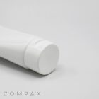 A close-up image shows a white cylindrical plastic tube with a flip-top cap. On the bottom left corner, the word "40mm Flip Top" is written in light gray, minimalist font against a plain white background.