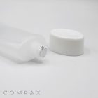 A 50mm Oval Screw Top squeezable plastic tube with a metallic seal is lying on its side, with its white cap placed nearby. The brand name "COMPAX" is visible in the lower left corner. The background is plain white.