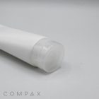 A close-up of a white plastic tube with a clear, round cap lying on its side against a plain light grey background. The product name, "50mm Flip Top," is subtly displayed in the bottom-left corner of the image.