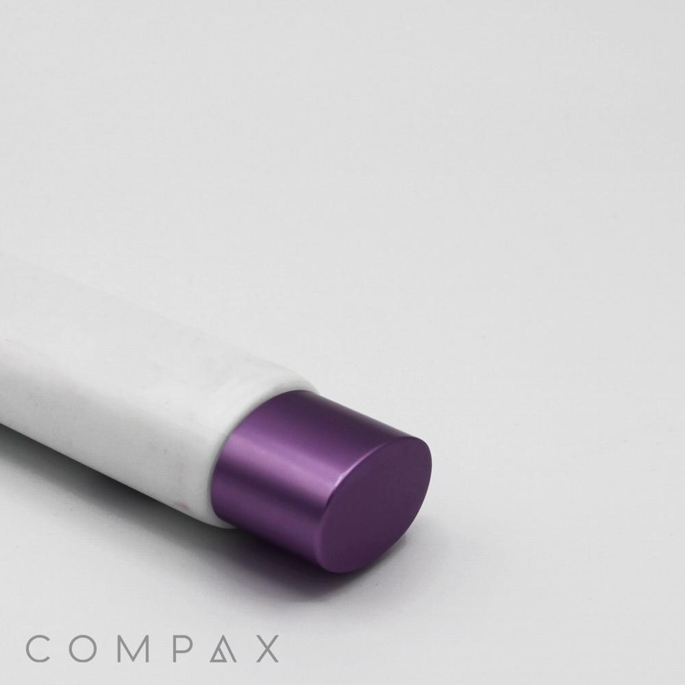 A close-up image of a 30mm Oval Screw Top with a white cylindrical container and a purple cylindrical cap, placed horizontally against a plain white background. The word "COMPAX" is visible at the bottom left corner of the image.