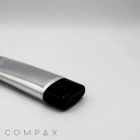 A 40mm Flat Screw Top, featuring a sleek metallic tube with a black cap, lies on a plain white surface. The brand name "COMPAX" is visible in the bottom left corner.