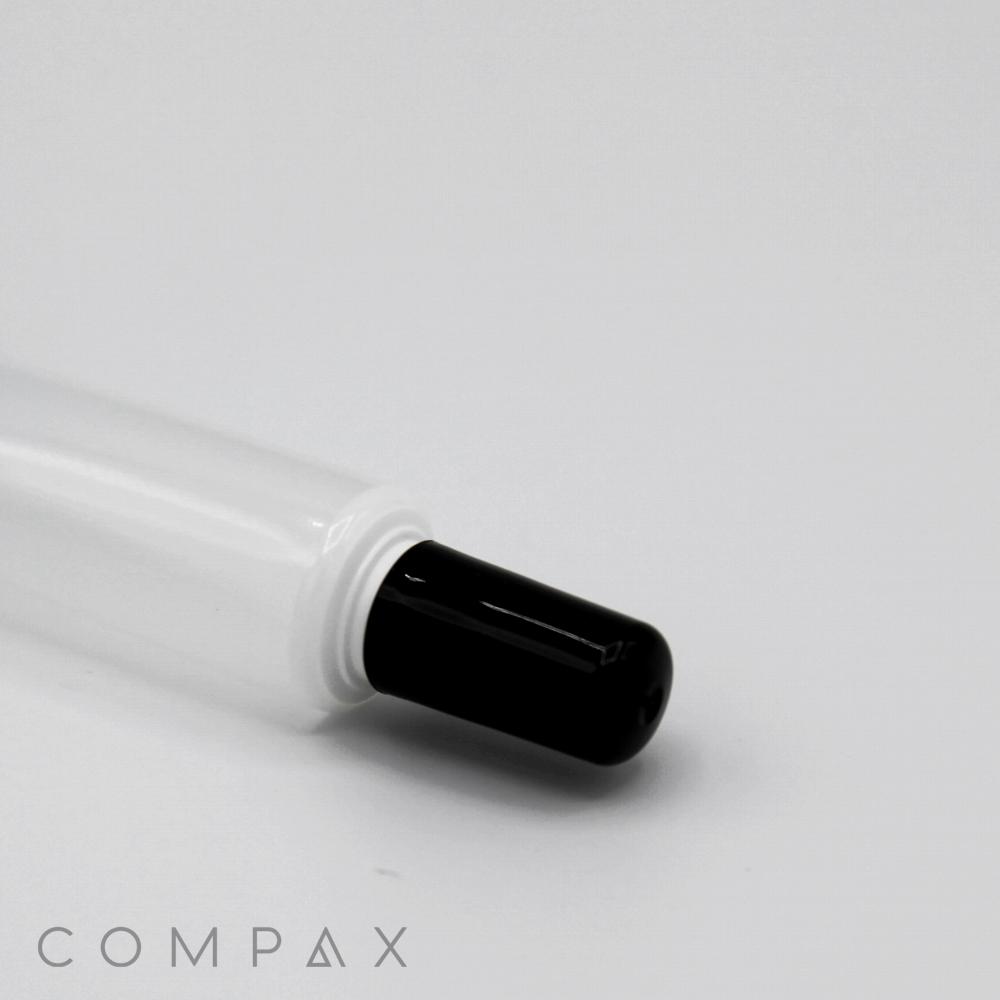 A minimalist image of a black 16mm Needle Nose pen tip with a semi-transparent white barrel against a plain white background. The word "COMPAX" is printed on the image in the bottom left corner.