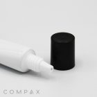 A close-up image of a white plastic squeeze tube with its black cap removed and placed beside it. The tube features a small nozzle for dispensing its contents. The product name "19mm Needle Nose" is visible in the bottom-left corner of the image.