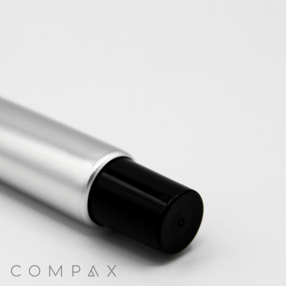 A close-up image of a 22mm Needle Nose, featuring a silver cylindrical body with a black cylindrical end, set against a white background. The word "COMPAX" is written in light gray, uppercase letters at the bottom left corner.
