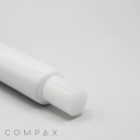 A close-up image of the 25mm Needle Nose, featuring a white cylindrical body with a smaller white cylindrical tip extending from it. The background is plain and light-colored, and the word "COMPAX" is visible in the bottom left corner of the image.