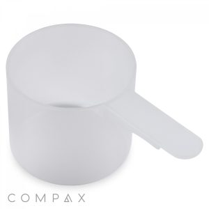 An image of the 60cc Scoop, a translucent plastic measuring scoop with a short, flat handle extending from its side. The word "COMPAX" is printed in the bottom left corner.