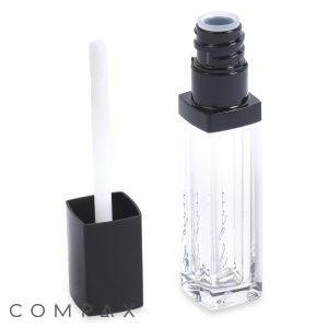 A tube of Square Lip Gloss with black accents is displayed against a white background. The cap is removed, revealing a white doe-foot applicator attached to it. The transparent container showcases the clear lip gloss inside.