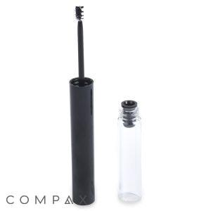 The Round Mascara Bottle, in its sleek black cylindrical design, stands open next to its clear cap, revealing the mascara wand with visible bristles coated in the dark cosmetic product.