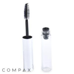 Open tube of the Round Mascara Bottle with a silver cap and a black bristle wand applicator. The applicator is resting on the side of the bottle, which stands upright to showcase its clear internal chamber designed to hold the mascara product. The background is white.
