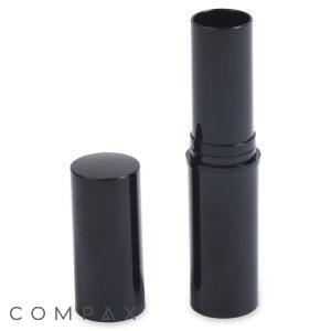 A black, cylindrical tube of Round Lipstick is open, its cap positioned beside it. The extended tube reveals an empty compartment where the lipstick would usually reside. The overall design is sleek and minimalist.