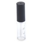 The Round Lip Gloss Bottle is a clear, cylindrical glass container with a black, cylindrical twist-off cap. The bottle seems to be empty and stands upright, featuring faint writing on the glass.