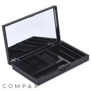 The 9 Well Rectangular Compact is an open black makeup organizer featuring a mirror on the inside of the lid. It boasts multiple compartments of various sizes for storing cosmetics or accessories. The lid is propped open, revealing the empty compartments inside.