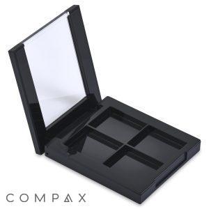 A black, **4 Well Square Compact**, featuring four empty compartments and a small mirror on the lid, is open and positioned vertically. The compact boasts a sleek and clean design, perfect for customizing with your favorite makeup products.