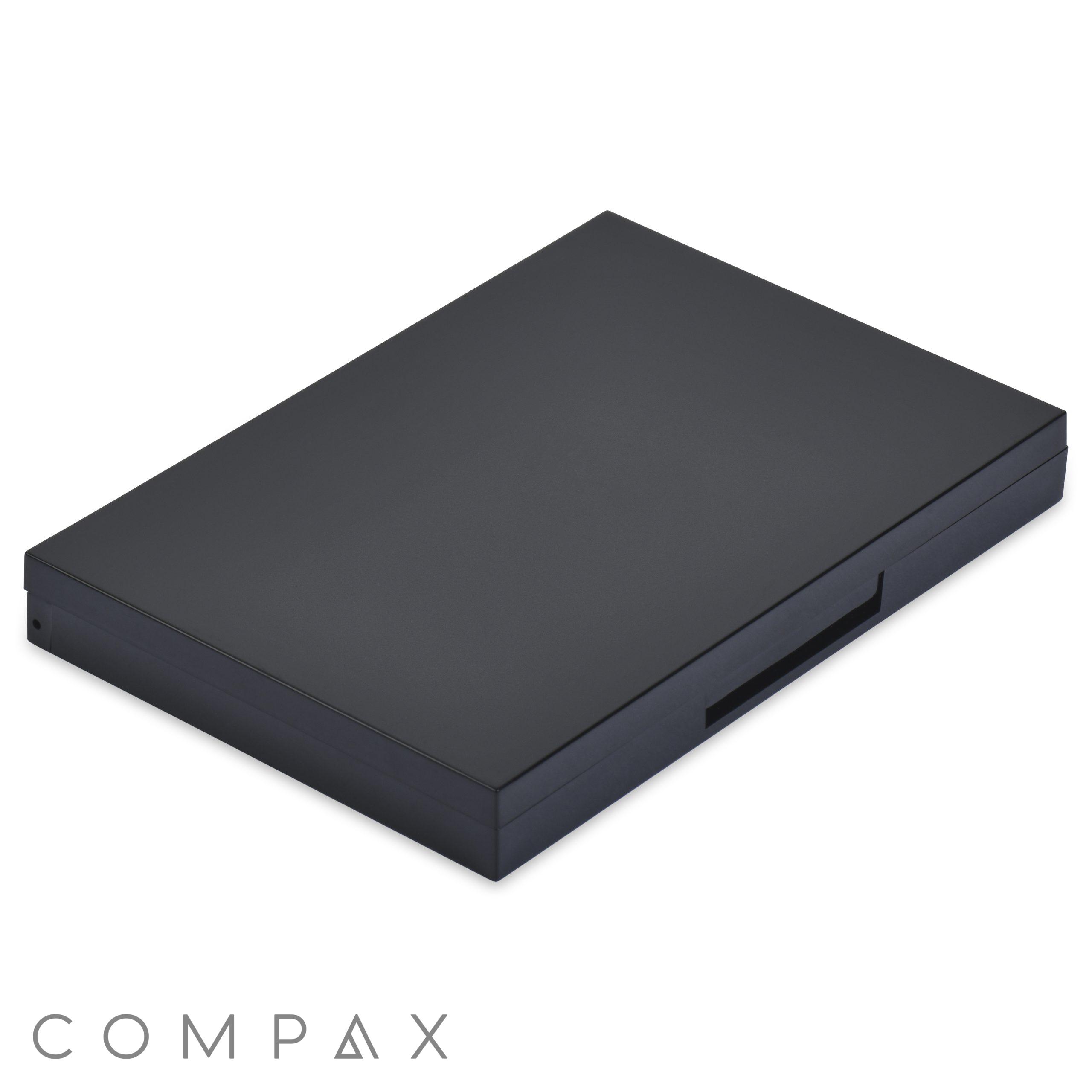 A sleek, closed 12 Well Rectangular Compact with a minimalist design is shown from an angled view. The compact appears thin and lightweight, with smooth surfaces and sharp edges. There is no visible branding or features on the top cover.