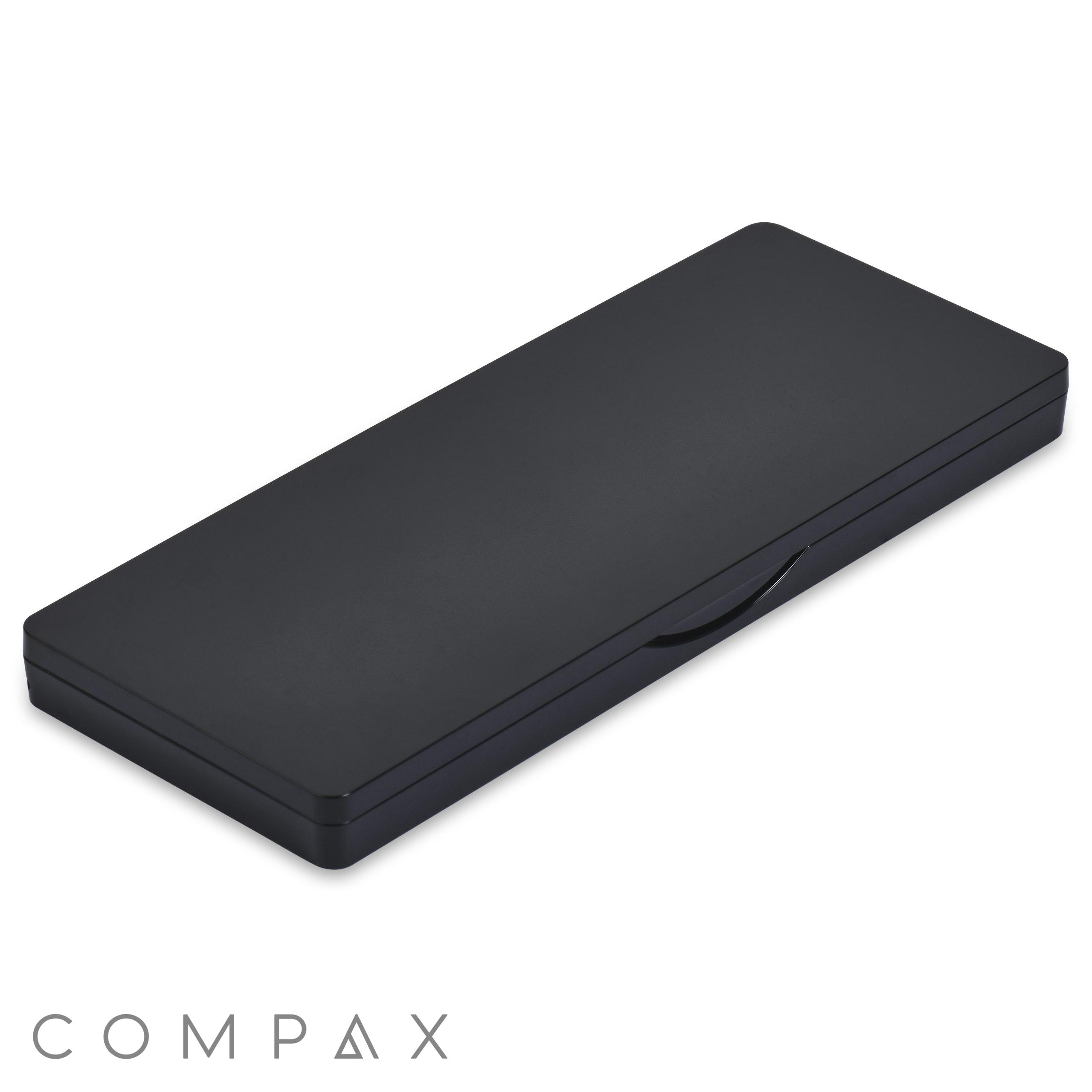 A closed, black Single Pan Rectangular Compact with Mirror featuring a matte finish. The compact is equipped with a small latch on the front, complementing its sleek and minimalist design. Its smooth and unadorned surface suggests a professional or elegant storage solution.