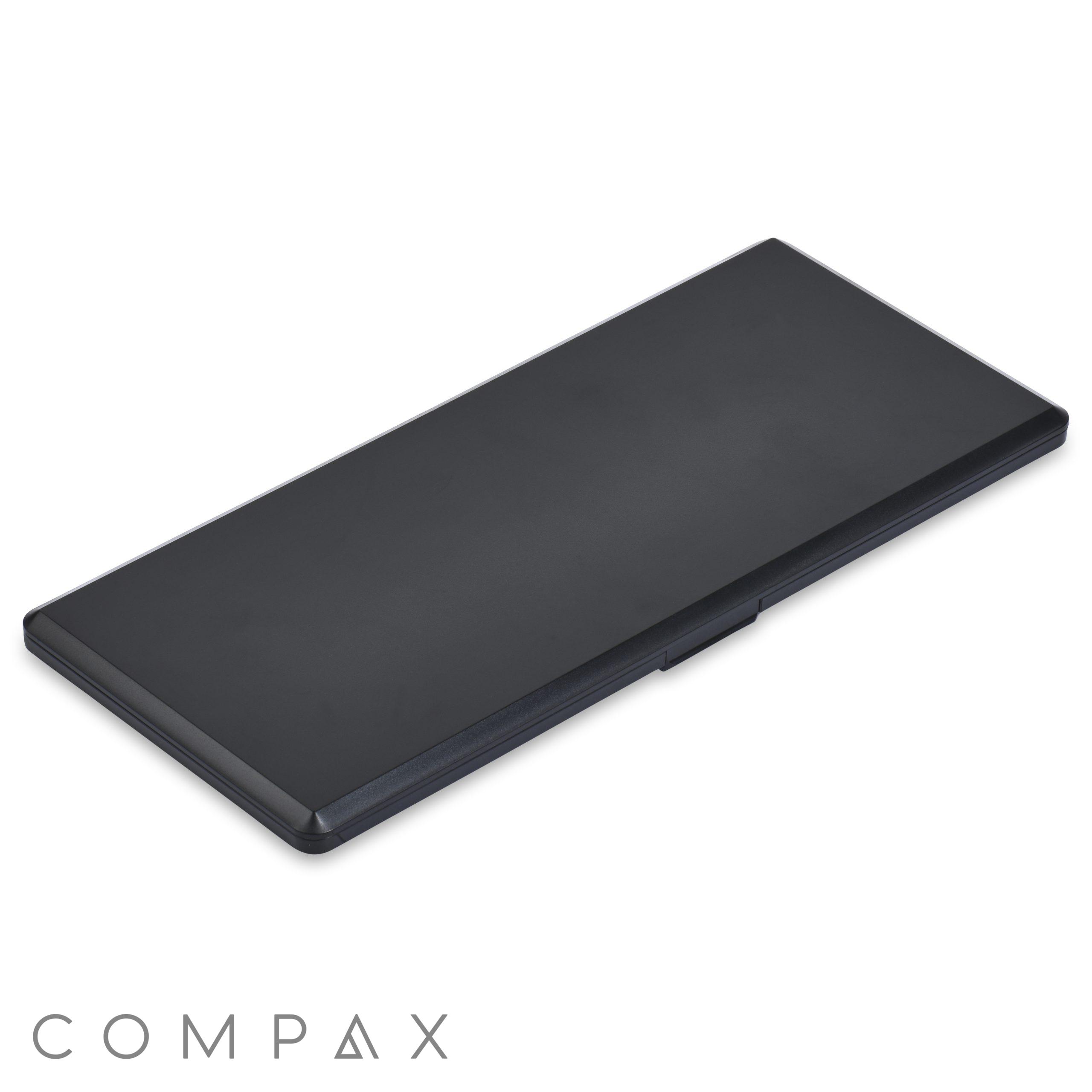 A 10 Well Rectangular Compact, elegantly designed in black plastic with clean lines and a sleek matte finish, closed and positioned against a white background. The compact appears slim and minimalistic.