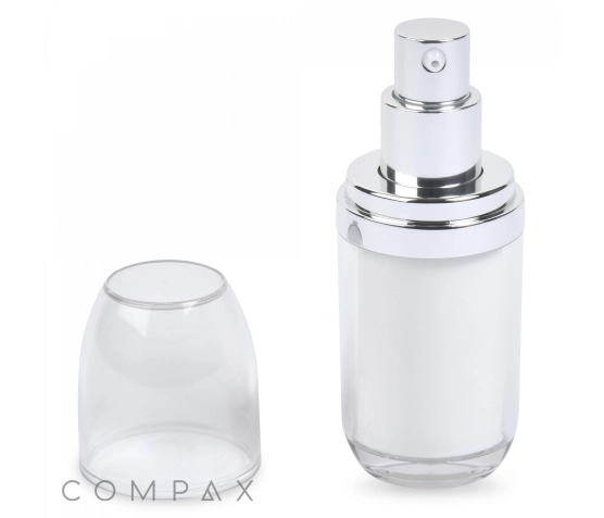 A sleek, cylindrical white and silver pump dispenser bottle with a clear plastic cap removed and placed to the left side. The bottle appears to be for cosmetics or skincare products. The word "COMPAX" is visible in grey at the bottom left corner.