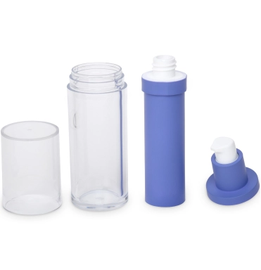 A transparent cylindrical plastic bottle with its clear cap removed, revealing a blue-colored pump mechanism disassembled into three parts: the main pump body, the pump head, and the nozzle, displayed against a white background.