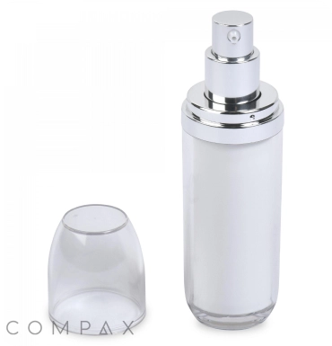 A white and silver pump bottle stands upright with its transparent cap placed beside it. The bottle has a sleek, cylindrical design and is partially transparent, revealing the liquid contents inside. The word "COMPAX" is displayed at the bottom left.
