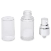 A clear airless pump bottle with the cap and silver pump dispenser top removed and placed beside it.