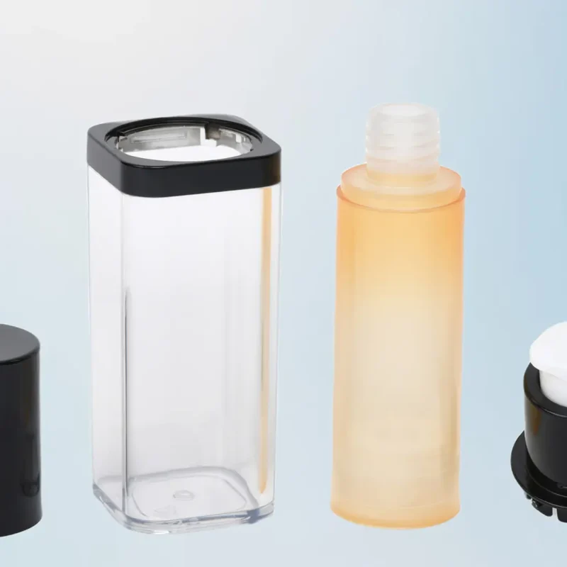 Four cosmetic container components are displayed: a black cap, a clear rectangular bottle, a frosted orange bottle with a screw-top opening, and a small black applicator with a white rounded tip, arranged in that order against a gradient blue background.