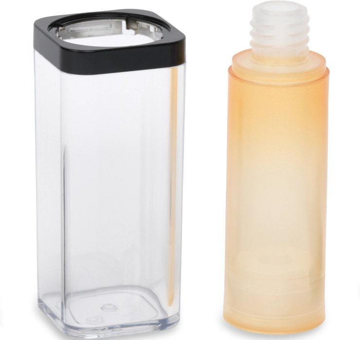 A transparent rectangular container with a black top placed beside a frosted cylindrical tube with a white ribbed cap. The cylindrical tube appears to fit inside the rectangular container.