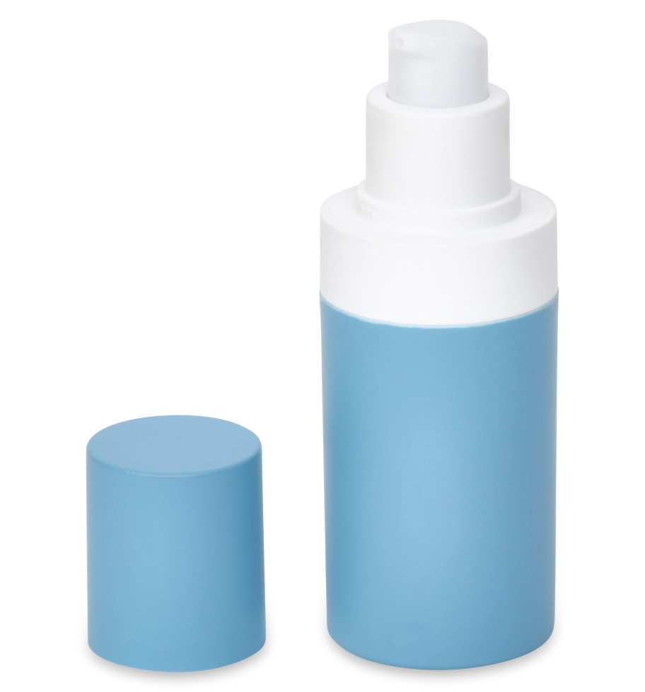 A blue and white pump bottle with its cap off, standing upright. The bottle is cylindrical with a smooth surface. The cap, matching in color, is placed beside it. The background is plain and neutral.